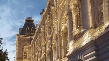 An Illuminated Historic Building Captivatingly Glows at Dusk, Creating a Charming Atmosphere. Action video