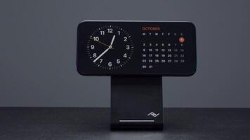 UK, London - September 15, 2023. iphone on charging stand. Action. Stylish stand with charging for new iPhone 15 pro. Addition to iPhone 15 pro Charging Station Stand video