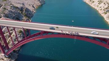 Aerial that conveys the feeling of vertigo, dizziness on a bridge above the sea. fear of heights and emptiness. Bungee jumping from a high bridge, defeat fears video