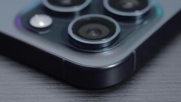 China, Beijing - September 15, 2023. Close-up of camera of iPhone 15 pro. Action. Stylish camera design of new version of iPhone 15 pro max. iPhone 15 pro max with new camera in stylish shooting for video