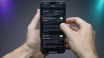 China, Beijing - September 15, 2023. Software setup of new iPhone 15 pro. Action. Setting parameters inside iPhone 15 pro software. Person manually adjusts parameters in iPhone 15 pro software video