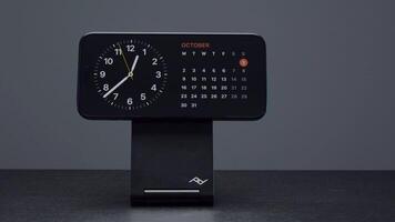 UK, London - September 15, 2023. iphone on charging stand. Action. Stylish stand with charging for new iPhone 15 pro. Addition to iPhone 15 pro Charging Station Stand video