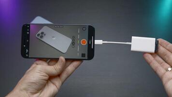 China, Beijing - September 15, 2023. External drive for phone. Action. External memory card for new iPhone 15 pro. External storage disk for shooting videos and photos in new iPhone