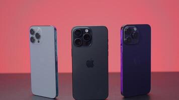 New York - September 15, 2023. iPhones of different generations in comparison. Action. Comparison of new iPhone 15 with versions 14 and 13 generations. Design of iPhones 13, 14 and 15 promax versions video