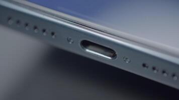 China, Beijing - September 15, 2023. Close-up of type C connector on phone. Action. New iPhone 15 pro with type C connector. Functional USB-C charging connector on new iPhone 15 pro max video