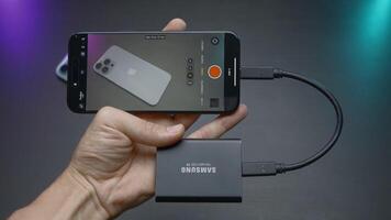 China, Beijing - September 15, 2023. External drive for phone. Action. External memory card for new iPhone 15 pro. External storage disk for shooting videos and photos in new iPhone