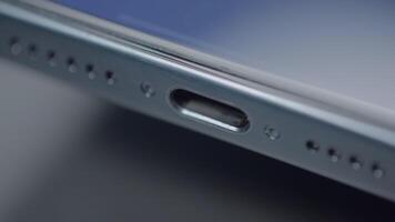 China, Beijing - September 15, 2023. Close-up of type C connector on phone. Action. New iPhone 15 pro with type C connector. Functional USB-C charging connector on new iPhone 15 pro max video