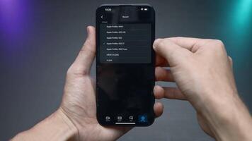 China, Beijing - September 15, 2023. Settings of new iPhone 15 pro. Action. Close-up of man setting up new iPhone 15 pro. Software and interface settings in new iPhone 15 pro video