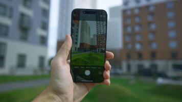 China, Beijing - September 15, 2023. Close-up of iPhone 15 Pro screen with camera shooting. Action. Person holds phone and tries shooting modes with zoom effect. Phone screen taking pictures of video