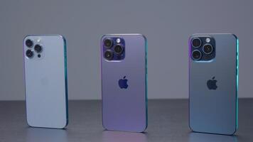 New York - September 15, 2023. Comparison of design of new iPhone models. Action. New model of iPhone 15 pro max in comparison with version of 14th and 13th generations. Comparison of design of new video