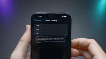 China, Beijing - September 15, 2023. Software setup of new iPhone 15 pro. Action. Setting parameters inside iPhone 15 pro software. Person manually adjusts parameters in iPhone 15 pro software video