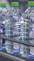 The Modern Water Bottling Process Utilizes Clear Plastic Containers for Optimal Efficiency. Media video