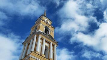 Time lapse accelerated movement of clouds in the blue sky over the Christian Church. Clip. Religion concept, low angle view of a church tower. video