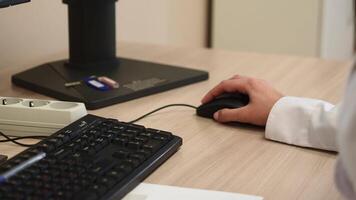Close up of female hands typing on computer keyboard at the office. Clip. Young woman using computer. video