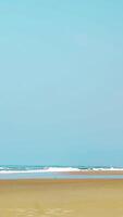 Enjoy a Serene Beach with Gently Rolling Waves and a Beautiful Blue Sky Above You. Stock Clip video