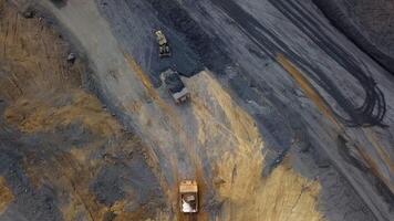 A stunning aerial view depicting heavy machinery engaged in large scale mining operations. Stock Clip video