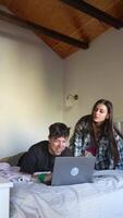 Friends Having a Great Time Together While Using a Laptop in a Cozy Room Setting video