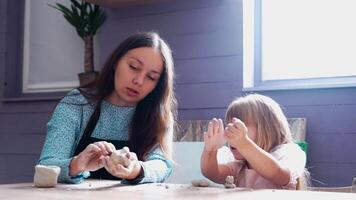 A creative clay modeling session with a child at home in the afternoon video