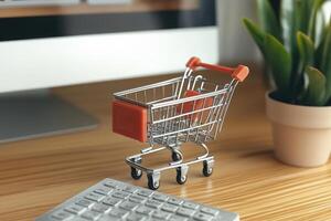 A Symbol of Online Shopping A Miniature Shopping Cart photo