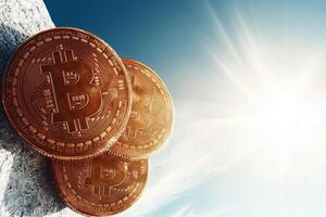 A group of Bitcoin coins resting on a rock overlooking a vast landscape, symbolizing the rise and impact of cryptocurrency. photo