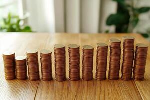 A row of coins stacked in increasing height, symbolizing financial growth and stability. photo