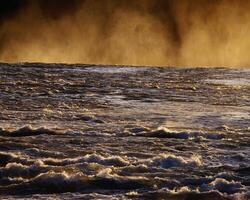 Serene Coastal Sunset. A Dusk View of Atmospheric Wonder Over Water photo