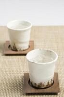 Cups on coasters photo