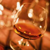 Cognac in a glass close view background photo