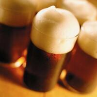Ale in a glass close view background photo