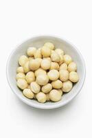 Roasted Macadamia Nuts in White Bowl photo