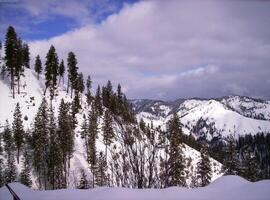 Mountain Landscape with Snow and Clouds in the Sky photo