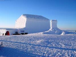 Snowy Glacier Landscape with Vehicle on Ice Cap Sloper photo