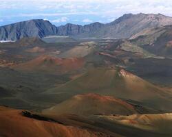 Majestic Mountain Range with Dramatic Cloud Formations and Expansive Valley Views photo