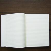 A white notebook with a blank page photo