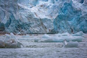 cruising in the Arctic in the Magdalensfjord on Svalbard along a glacier photo