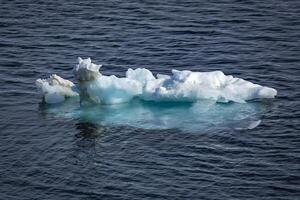 Cruising at perfect weather in the Arctic with an expedition between Nordaustlandet and Spitsbergen on Svalbard, Norway photo