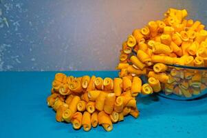 Citrus fruit peels strung on a string to make jam. photo