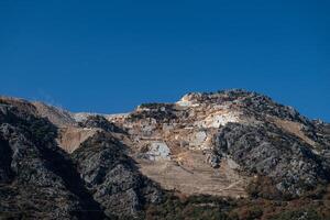 A marble quarry on top of a mountain. Environmental destruction. photo