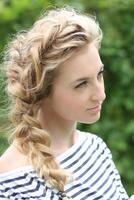 Portrait of the girl with a plait photo