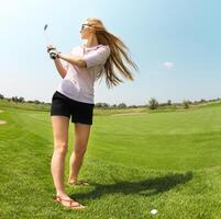 Female golf player at the course photo