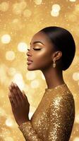 Young model in a sparkling dress poses elegantly with hands together against a shimmering background photo