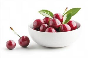 Fresh cherries glistening with water droplets in a silver bowl during a summer afternoon photo