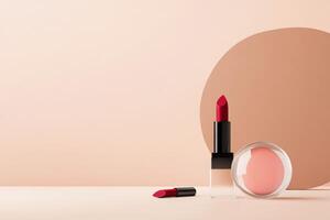 Stylish makeup display featuring red lipstick and cream blush against soft background photo