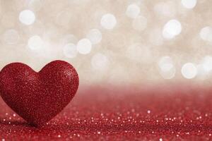 Heart shape painted on textured surface with splashes of red and white in background photo