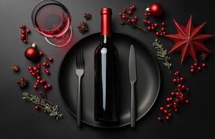 Festive table setting with black plate, wine bottle, and Christmas decorations for holiday dinner photo