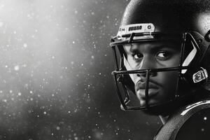 Intense football player wearing helmet and eye black during snowstorm at night photo