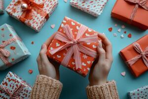 Colorful wrapped gifts with heart patterns on a blue background for a celebration photo