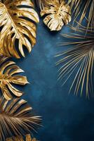 Golden tropical leaves against a dark blue background create an elegant decor theme photo