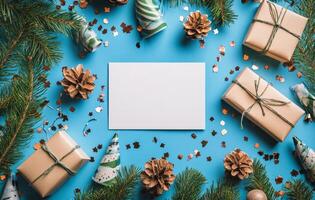 Festive arrangement with presents, pine cones, and decorations on a blue background for the holidays photo