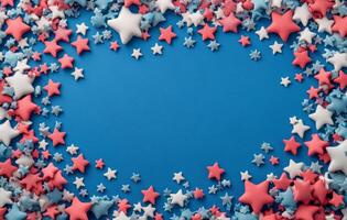 Colorful red, white, and blue star decorations arranged on a blue background for festive occasions photo